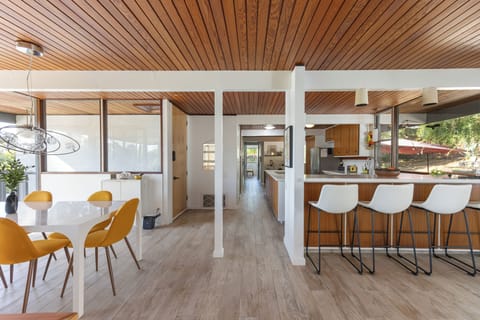 Plenty of seating awaits you at our dining room table or bar. Feel free to enjoy our record player or play the piano, adding a touch of music to your gathering or mealtime