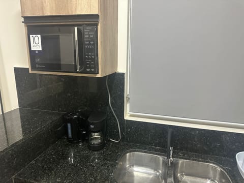 Microwave, stovetop, cookware/dishes/utensils, spices