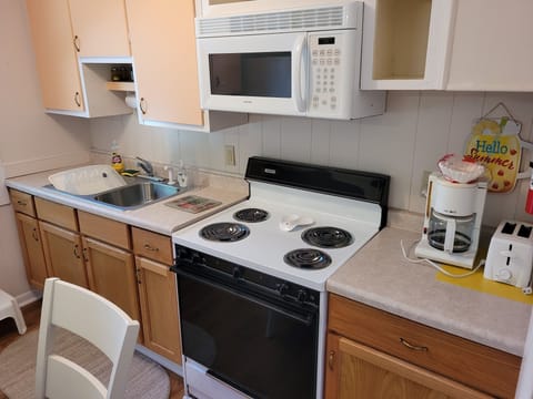 Microwave, oven, coffee/tea maker, cookware/dishes/utensils