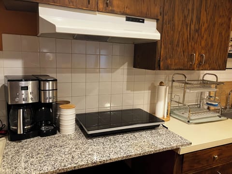 Fridge, stovetop, dishwasher, coffee/tea maker