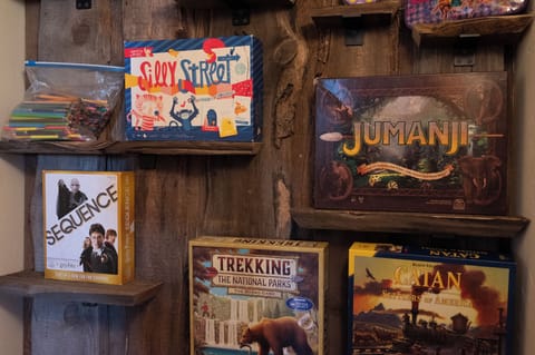 - Game nook with board games for fun indoor activities - Enjoy classics like Jumanji and adventure favorites - Entertainment for family nights and cozy days in