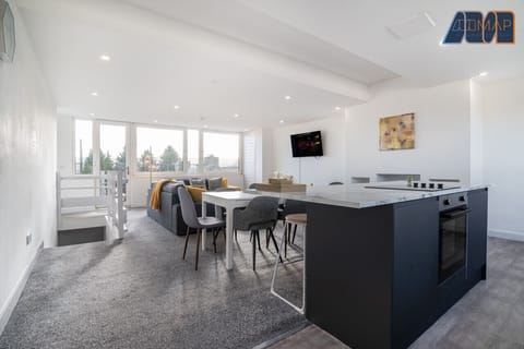 Modern, open-plan living with plenty of natural light and a cozy lounge area. Perfect for unwinding after a day of exploring!