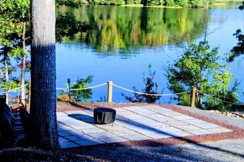 Unwind on the brand-new patio with serene water views, featuring a smokeless fire pit ideal for roasting marshmallows and making s'mores under the stars.