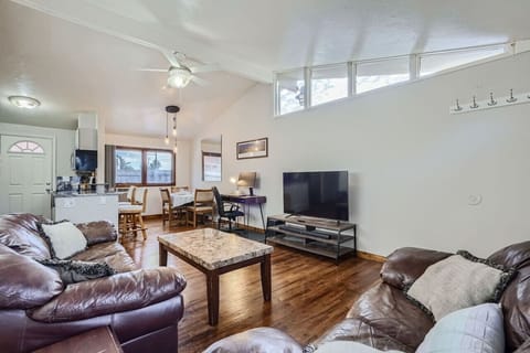 The open floor plan, vaulted ceilings, and natural light make the main area feel cozy and spacious