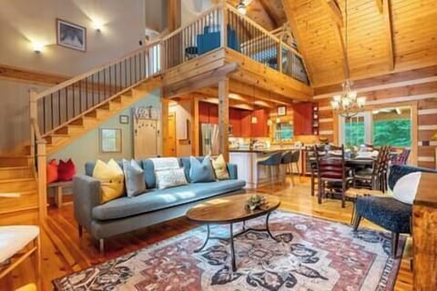 Open living room with wood ceilings, enjoy a cozy vibes & seamless kitchen flow
