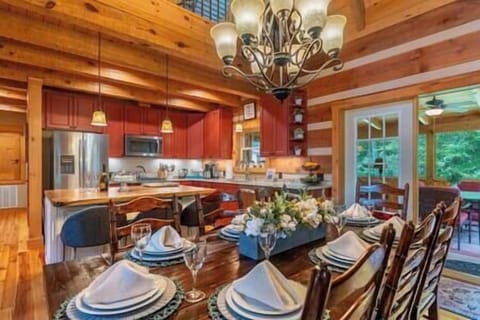 Wood-accented dining room with vaulted ceilings, perfect for shared meals