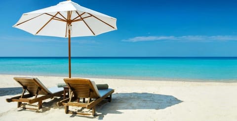 On the beach, sun loungers, beach towels