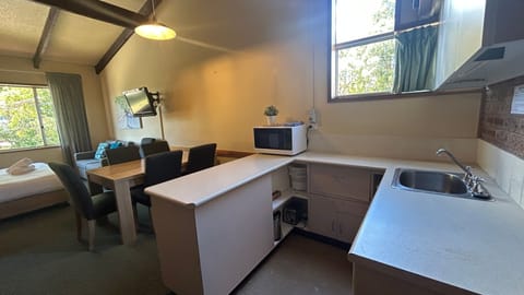 Microwave, toaster, dining tables