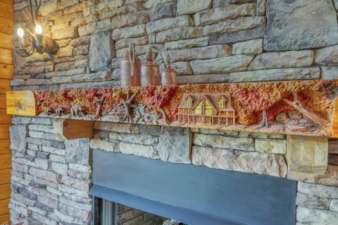 Custom carved mantle of Copper Elk cabin with bears.