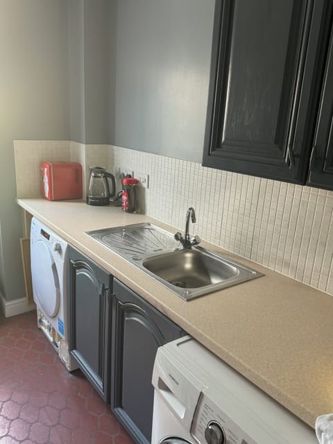 Fridge, electric kettle, cookware/dishes/utensils