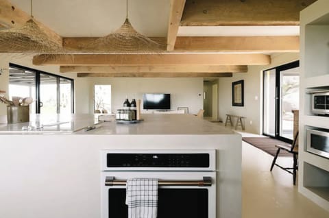 Cook a light meal while being part of the conversation; the kitchen opens up to the living area.