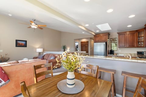 Indoor dining table seating for 4 plus 4 barstools at the breakfast bar.