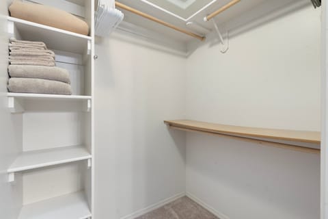 Walk-in closet available in the primary upstairs bedroom w/ extra bedding/towels
