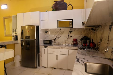 Fridge, microwave, coffee/tea maker, toaster