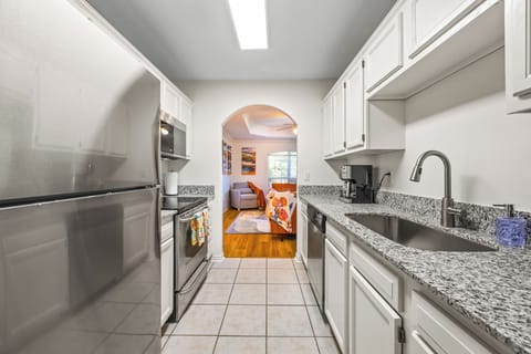 Our shiny kitchen opens up to our sunny living room.