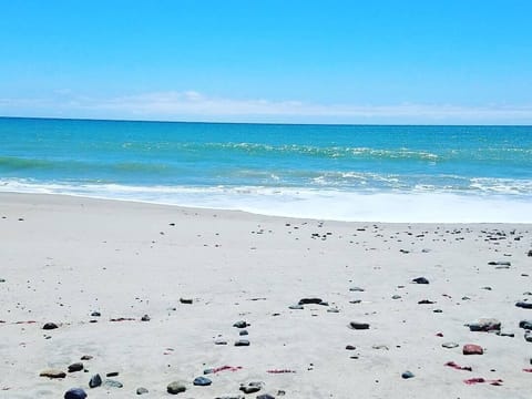 On the beach, sun loungers, beach towels