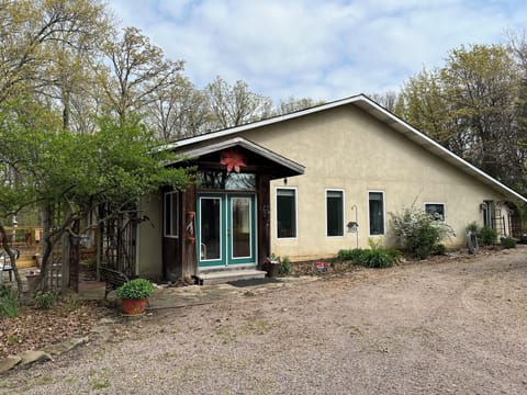 Front of home. Keyless entry on door to far right under arbor.