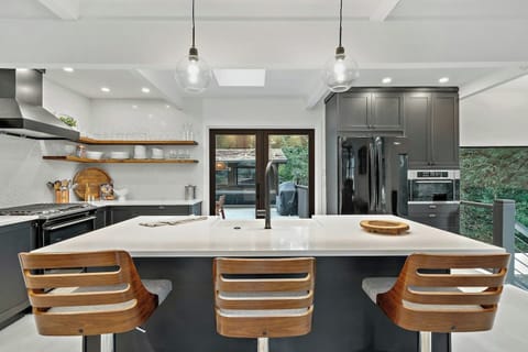 A versatile space for meals or casual chats, the kitchen’s bar seating keeps everyone connected.