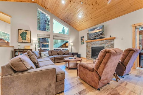 Living Room: Large l-shaped couch, 2 recliners, 55” Smart TV, gas fireplace, soaring windows, open layout, upper floor