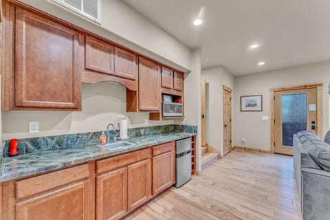 Bonus Room: 2 couches, 42” Smart TV, 4-person dining table, wet bar with microwave, mini fridge and sink, ground floor