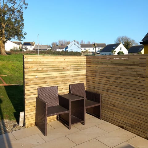 Sunny private seating area on patio. Green play area. Seamount Holiday Village No.26 , Seaside Holiday Home Available near Courtown Village, County Wexford