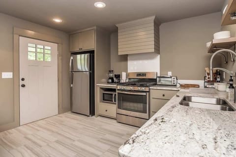 A stylish kitchen featuring modern appliances for cooking your favorite homemade dishes