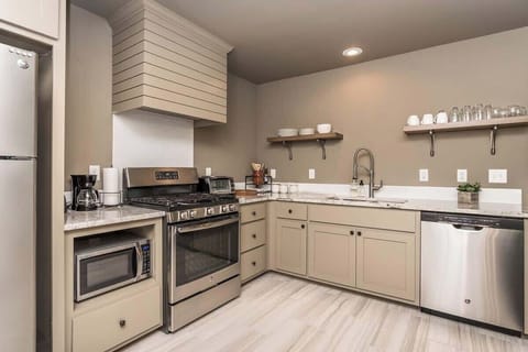 Your cooking space with these stunning white cabinets!