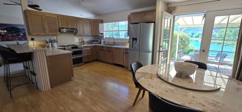 Bright and airy lakeside kitchen and dining.