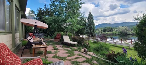 Outdoor deck with lake and mountain views on the walking / bike path