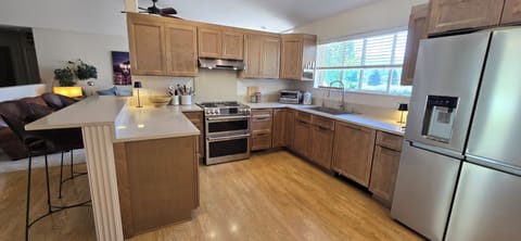 Organized kitchen with high end equipment and new appliances