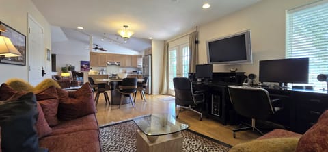 Office area with sectional sofa and 2 large work desks. Starlink high speed