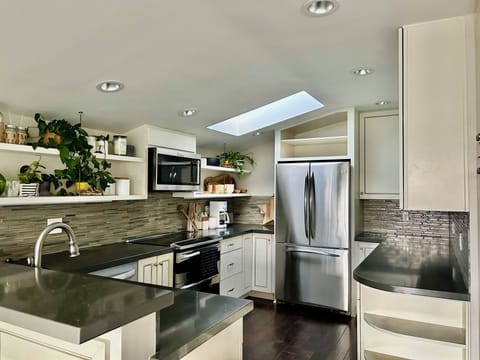 kitchen; includes 2 bar stools for additional seating next to dining area