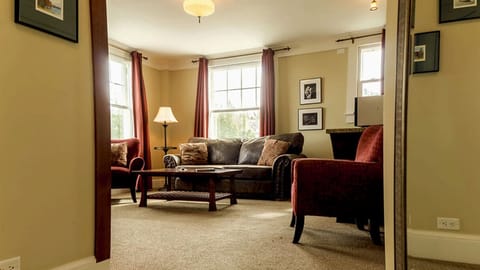 Lounge together in a bright corner living space with cozy textures.