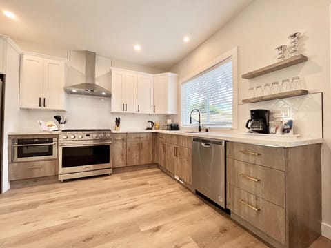 Cookware, utensils, coffee maker, toaster, and kettle for your use.