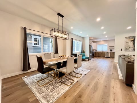 Soft overhead lighting above the table sets a warm and welcoming ambiance.