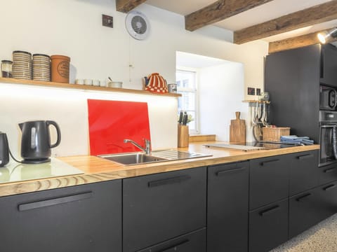 Kitchen with kettle and integrated cooker