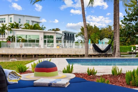 Enjoy a peaceful view across the waterfront, where the charming neighbor’s home adds to the serene and picturesque surroundings.