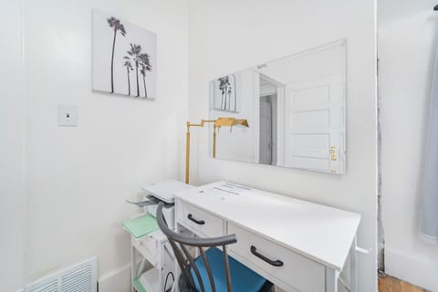 The third bedroom has a small office area