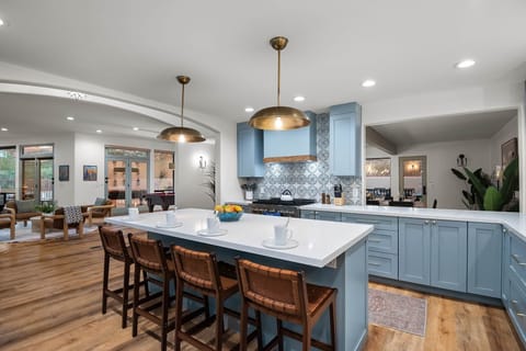 Kitchen fully equipped featuring microwave and 2 ovens