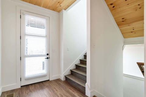 Step into style with natural light, inviting decor, and stunning wooden accents!