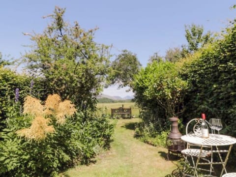 Private rear garden with chimnea and patio set | Roses Cottage, Santon, near Holmrook
