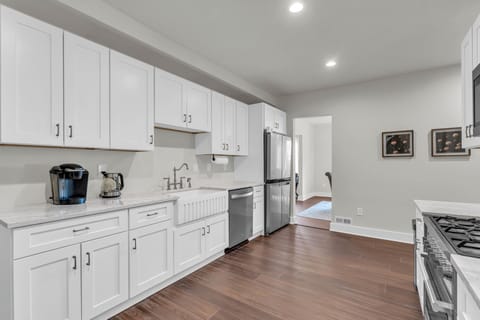 Bright, modern kitchen featuring white cabinetry