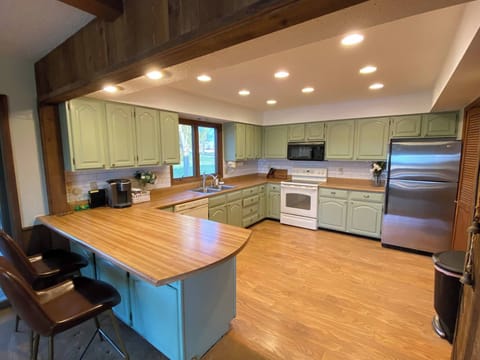 Come cook or bake! Kitchen has Keurig, Drip, and French press for coffee. Refrigerator, freezer, dishwasher, microwave, electric stove and garbage disposal. Plus a small assortment of pantry items.