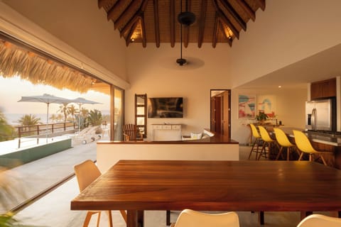 Enjoy meals with a backdrop of the ocean in this beautifully designed dining space with natural lighting.