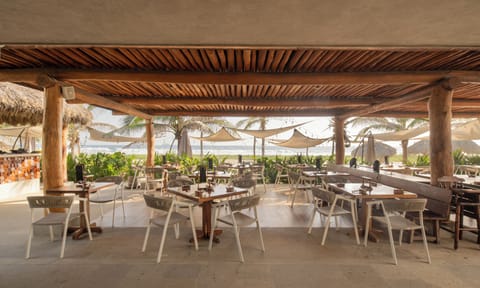 Dine and unwind at this beachfront restaurant, offering delicious meals with breathtaking panoramic ocean views.