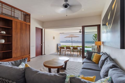 A stylish and inviting living space with plush seating, warm accents, and seamless indoor-outdoor flow.