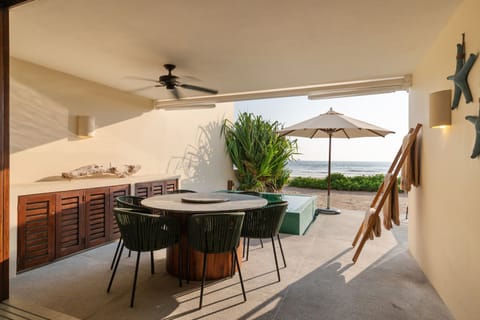 Enjoy the ocean breeze from this private terrace, featuring a stylish dining area, cozy seating, and a refreshing plunge pool.
