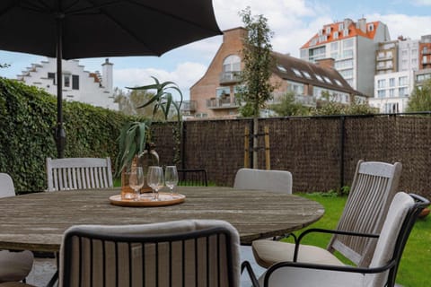 Private garden with fire pit and outdoor seating