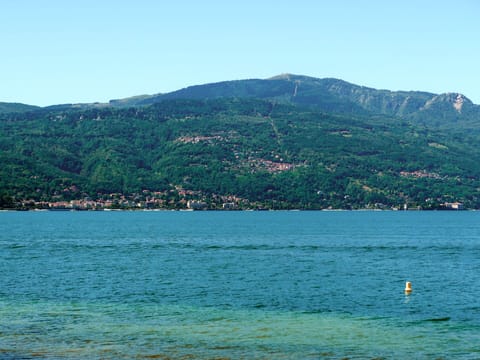Water, Sky, Mountain, Azure, Natural Landscape, Lake, Coastal And Oceanic Landforms, Tree, Mountainous Landforms, Horizon