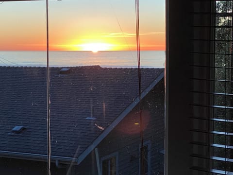 View from bed in Ocean View cottage's bedroom #3 "Blue Room".